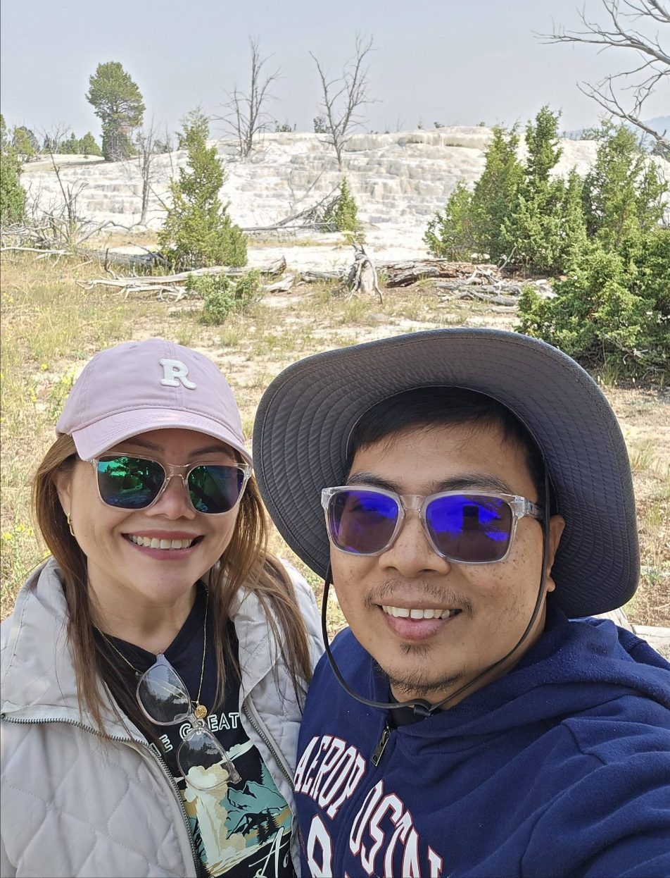 Rochelle and Nathaniel smiling together at Yellowstone National Park